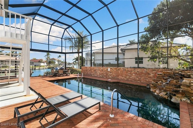 view of swimming pool with a water view and a lanai