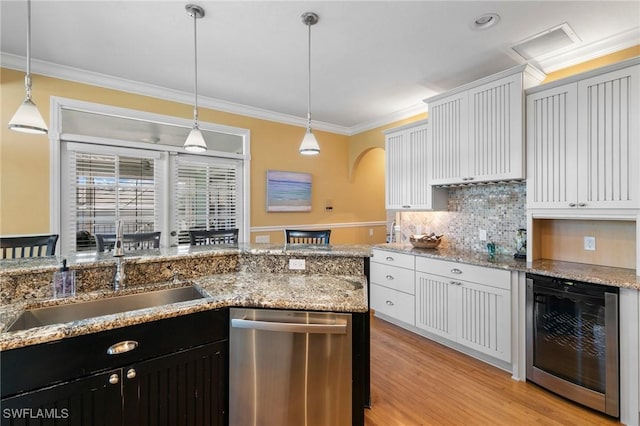 kitchen with dishwasher, white cabinets, wine cooler, and hanging light fixtures