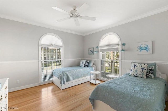 bedroom with access to outside, ceiling fan, wood-type flooring, and ornamental molding