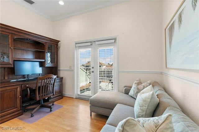 office space with crown molding and light hardwood / wood-style flooring