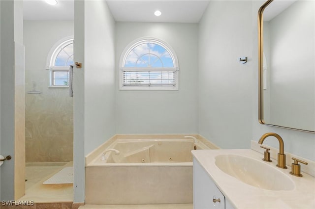 bathroom featuring tile patterned floors, vanity, and independent shower and bath