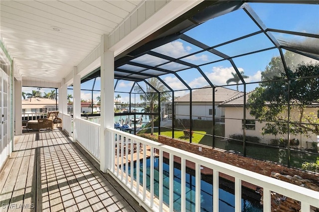 balcony featuring a water view and a patio