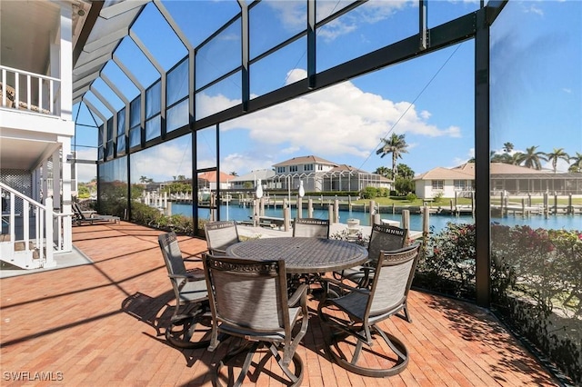 wooden terrace with a water view and a dock