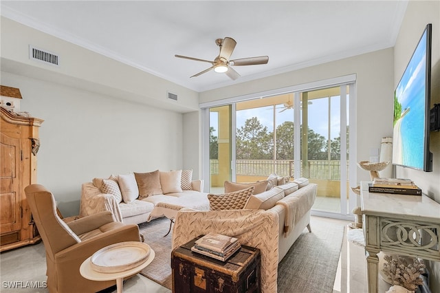 living room featuring crown molding and ceiling fan