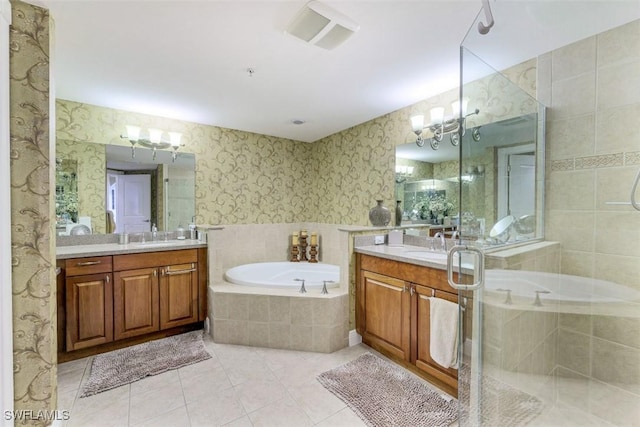 bathroom with tile patterned floors, separate shower and tub, and vanity