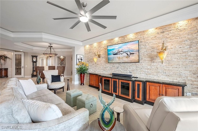 living room featuring ceiling fan and ornamental molding