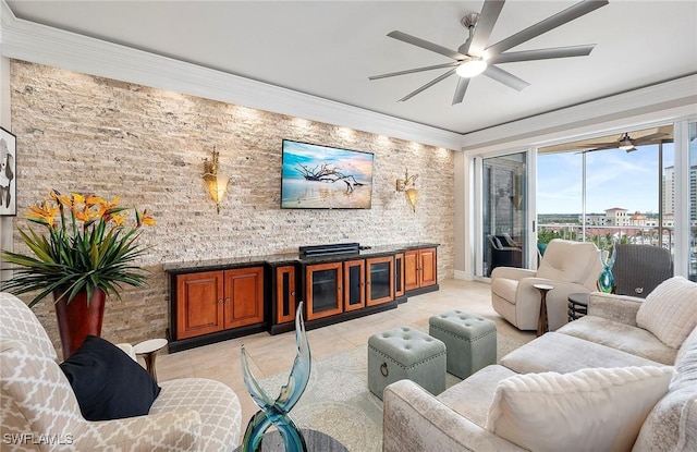 living room featuring ceiling fan, light tile patterned floors, and ornamental molding