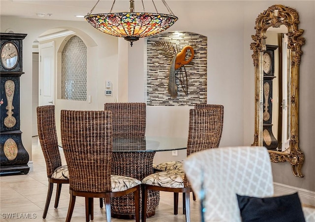 dining area featuring light tile patterned floors