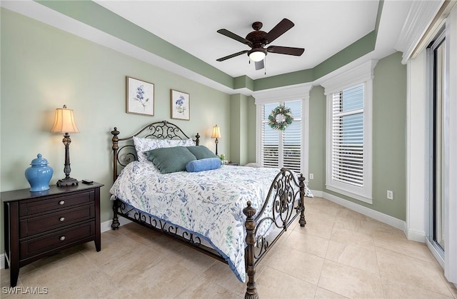 bedroom featuring ceiling fan, baseboards, and light tile patterned floors