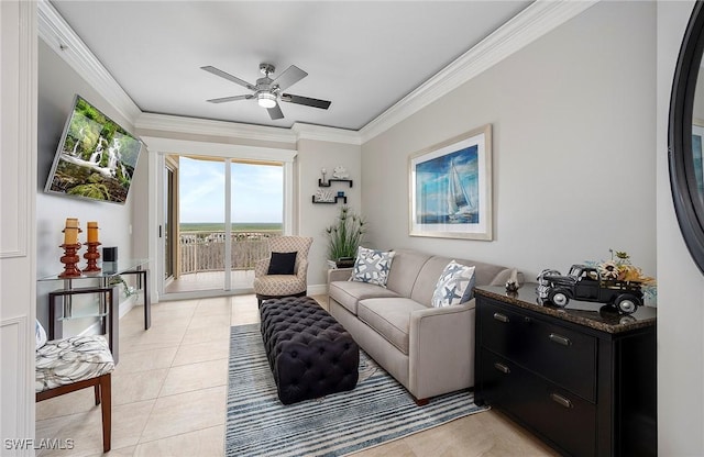 living room with ornamental molding, a ceiling fan, and light tile patterned floors