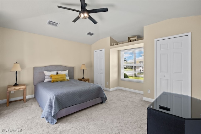 bedroom featuring ceiling fan, light carpet, and lofted ceiling