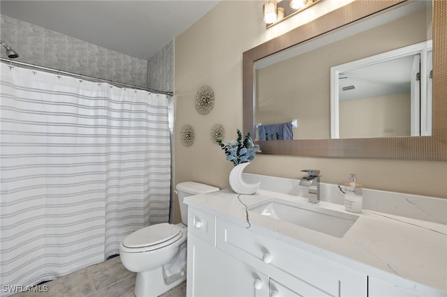 bathroom with tile patterned floors, curtained shower, vanity, and toilet