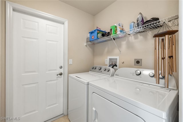 clothes washing area with separate washer and dryer