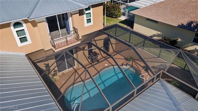 exterior space with a lanai and a patio area