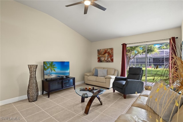 living room with ceiling fan, lofted ceiling, and light tile patterned flooring