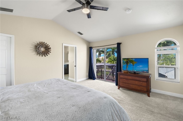 bedroom with lofted ceiling, light carpet, ensuite bathroom, ceiling fan, and access to exterior