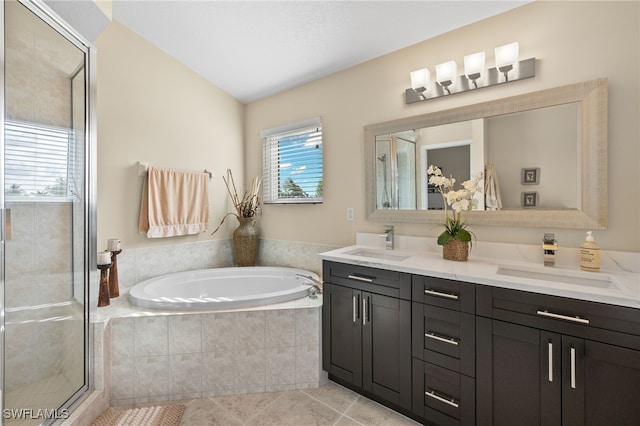 bathroom with tile patterned floors, vanity, lofted ceiling, and shower with separate bathtub