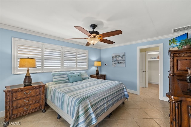 bedroom with ornamental molding, ceiling fan, and light tile patterned flooring