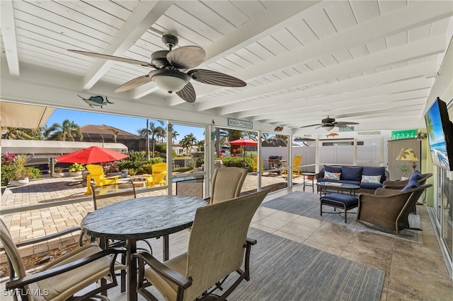 view of patio with outdoor lounge area and ceiling fan