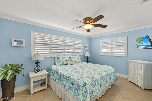 bedroom featuring ceiling fan, ornamental molding, and light tile patterned floors