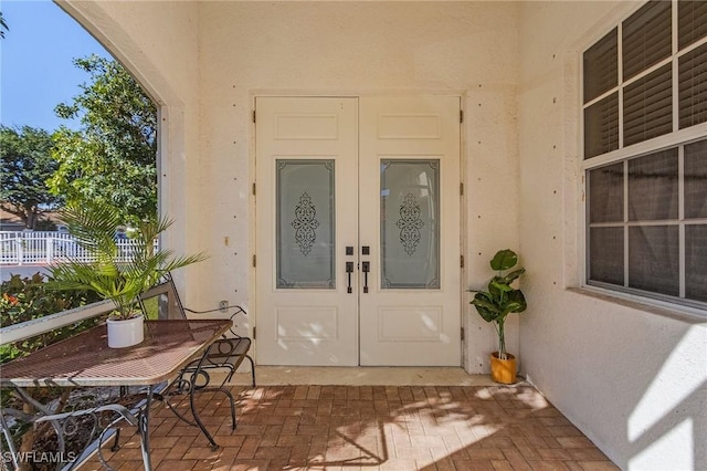 property entrance featuring french doors