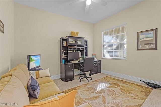 office space featuring light colored carpet and ceiling fan