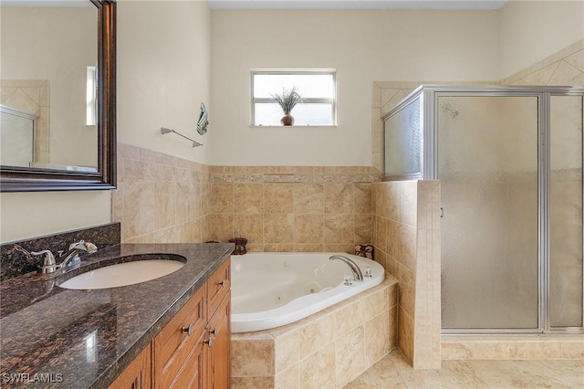 bathroom with separate shower and tub and vanity