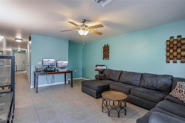 tiled living room with ceiling fan