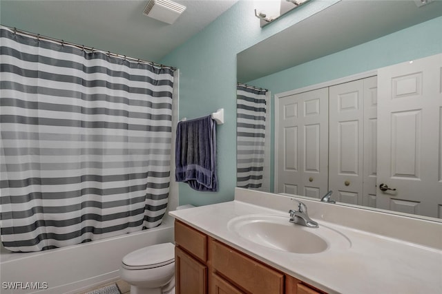 full bathroom featuring vanity, shower / bathtub combination with curtain, and toilet