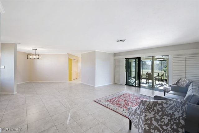 tiled living room featuring a notable chandelier