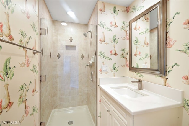 bathroom with vanity and an enclosed shower