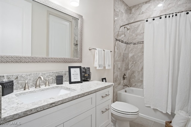 full bathroom with shower / tub combo, vanity, tile patterned flooring, and toilet