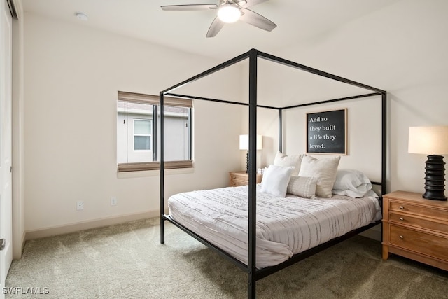 bedroom featuring ceiling fan and carpet