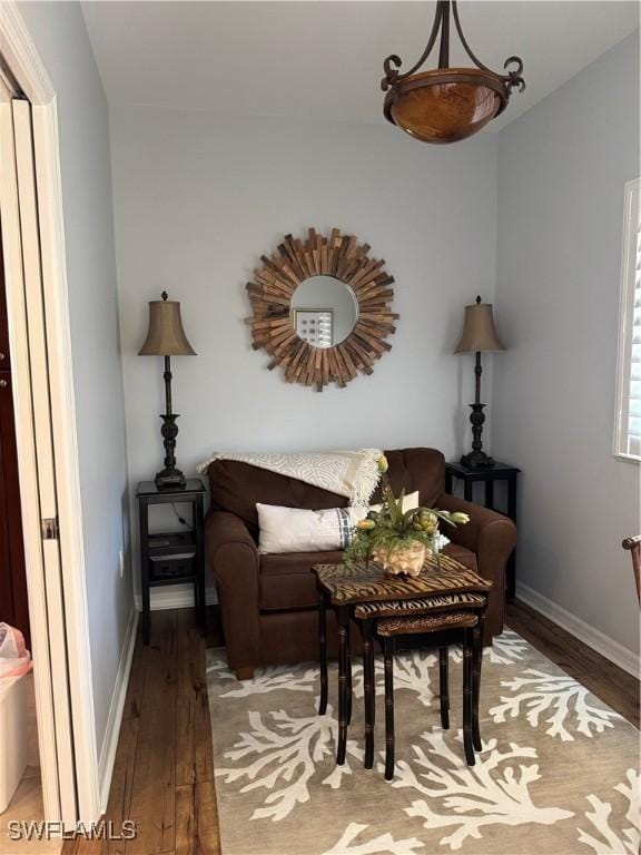 living area with hardwood / wood-style flooring