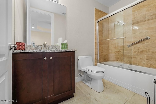 full bathroom featuring toilet, vanity, tile patterned floors, and combined bath / shower with glass door