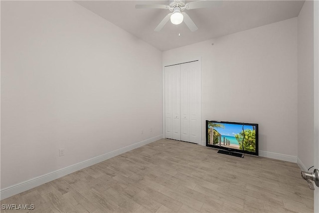 interior space with a closet, ceiling fan, and light hardwood / wood-style floors