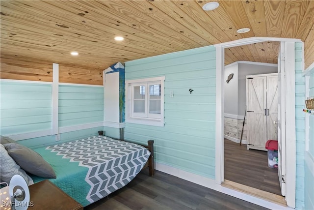 bedroom with wood ceiling, vaulted ceiling, wood walls, and hardwood / wood-style flooring