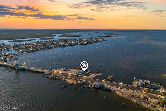 aerial view at dusk with a water view