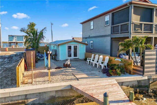 back of property with a patio area and french doors