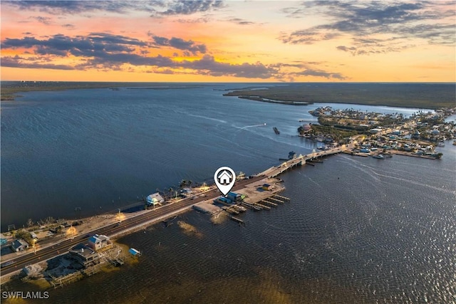 aerial view at dusk with a water view