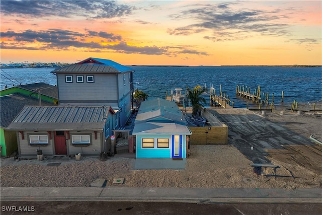 aerial view at dusk with a water view