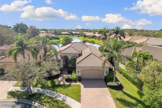 birds eye view of property with a water view