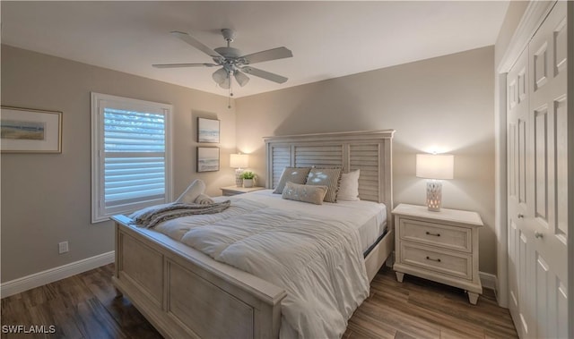 bedroom with ceiling fan, dark hardwood / wood-style flooring, and a closet