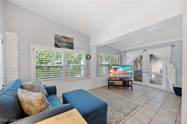 tiled living room featuring french doors and lofted ceiling