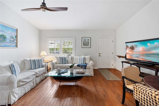 living room with ceiling fan and light wood-type flooring