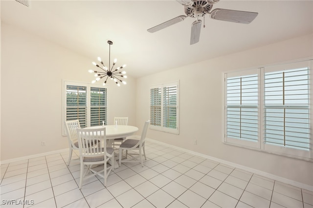 dining room with light tile patterned flooring, plenty of natural light, and baseboards