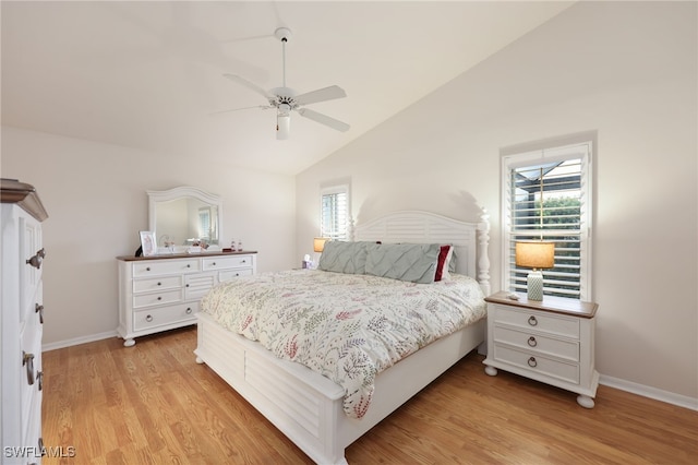 bedroom with lofted ceiling, ceiling fan, light wood-style flooring, and baseboards