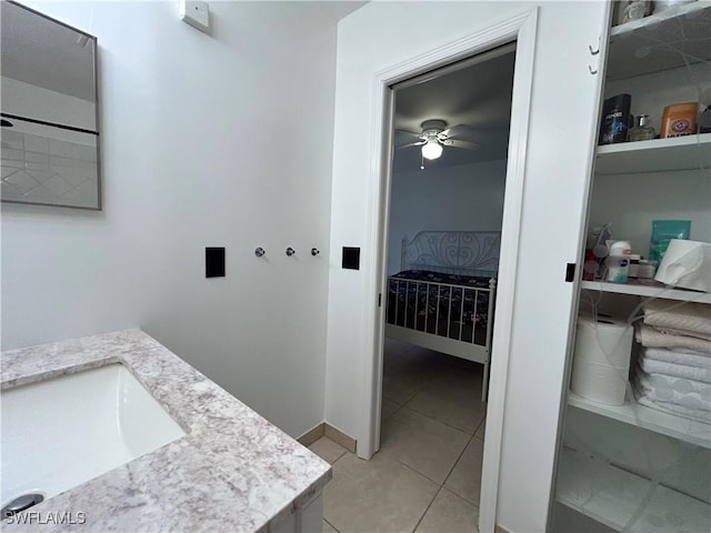 bathroom featuring ceiling fan, tile patterned flooring, and vanity