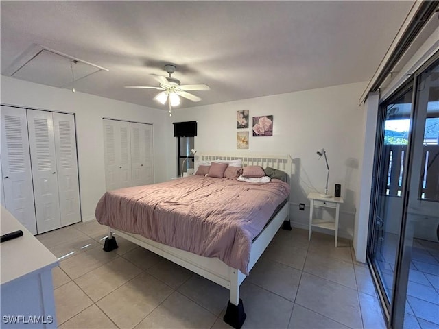 bedroom with ceiling fan, tile patterned flooring, access to outside, and multiple closets