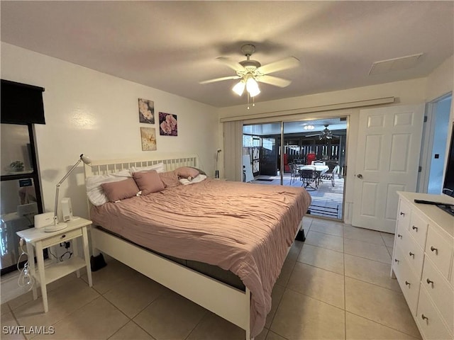 tiled bedroom with ceiling fan and access to exterior